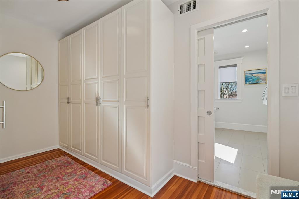 115 Park Street Montclair, NJ 07042 - Photo 28 of 45 a view of a hallway with wooden floor