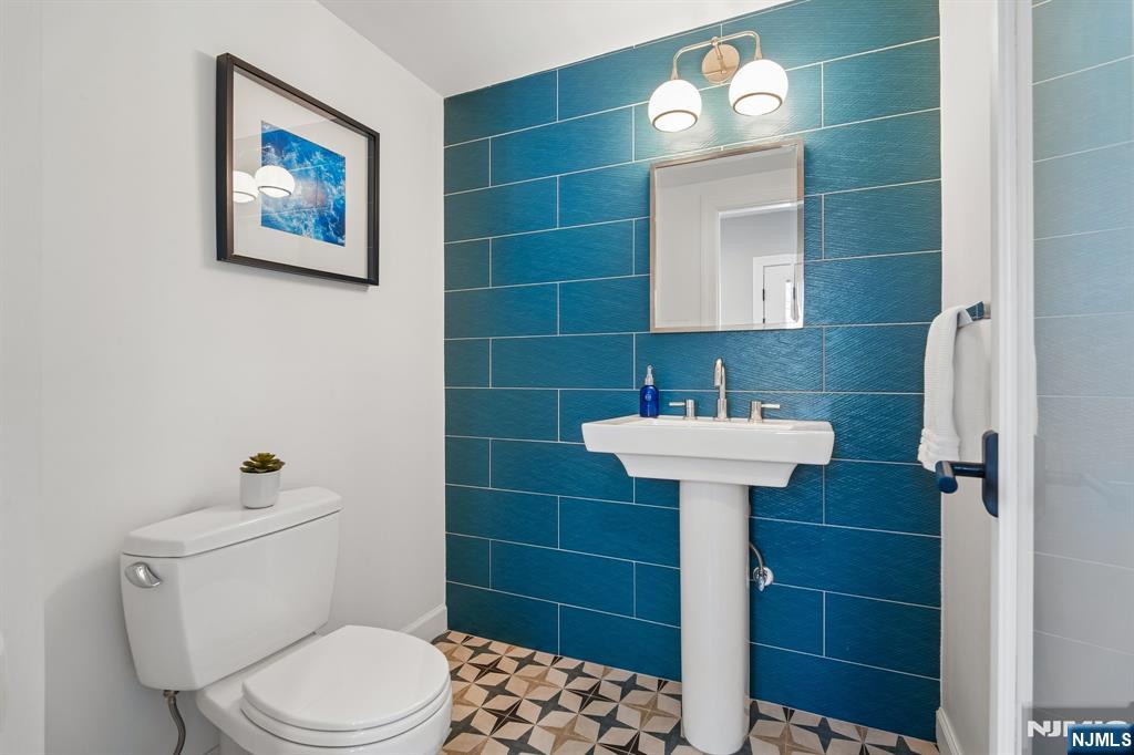 115 Park Street Montclair, NJ 07042 - Photo 32 of 45 a bathroom with a toilet sink and shower
