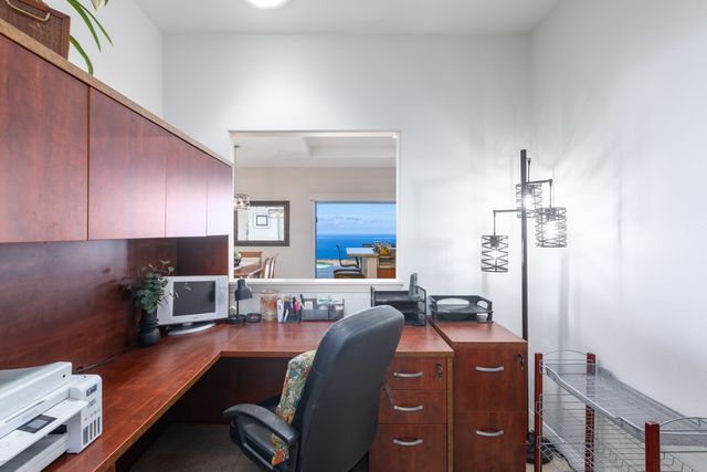 a view of a livingroom with furniture and a window