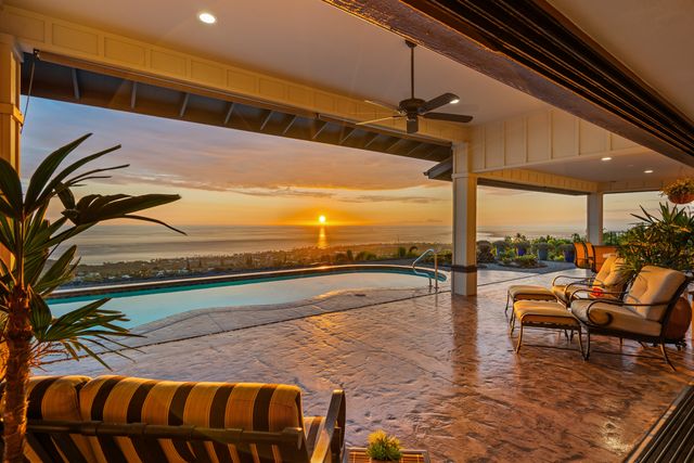 a view of swimming pool with outdoor seating