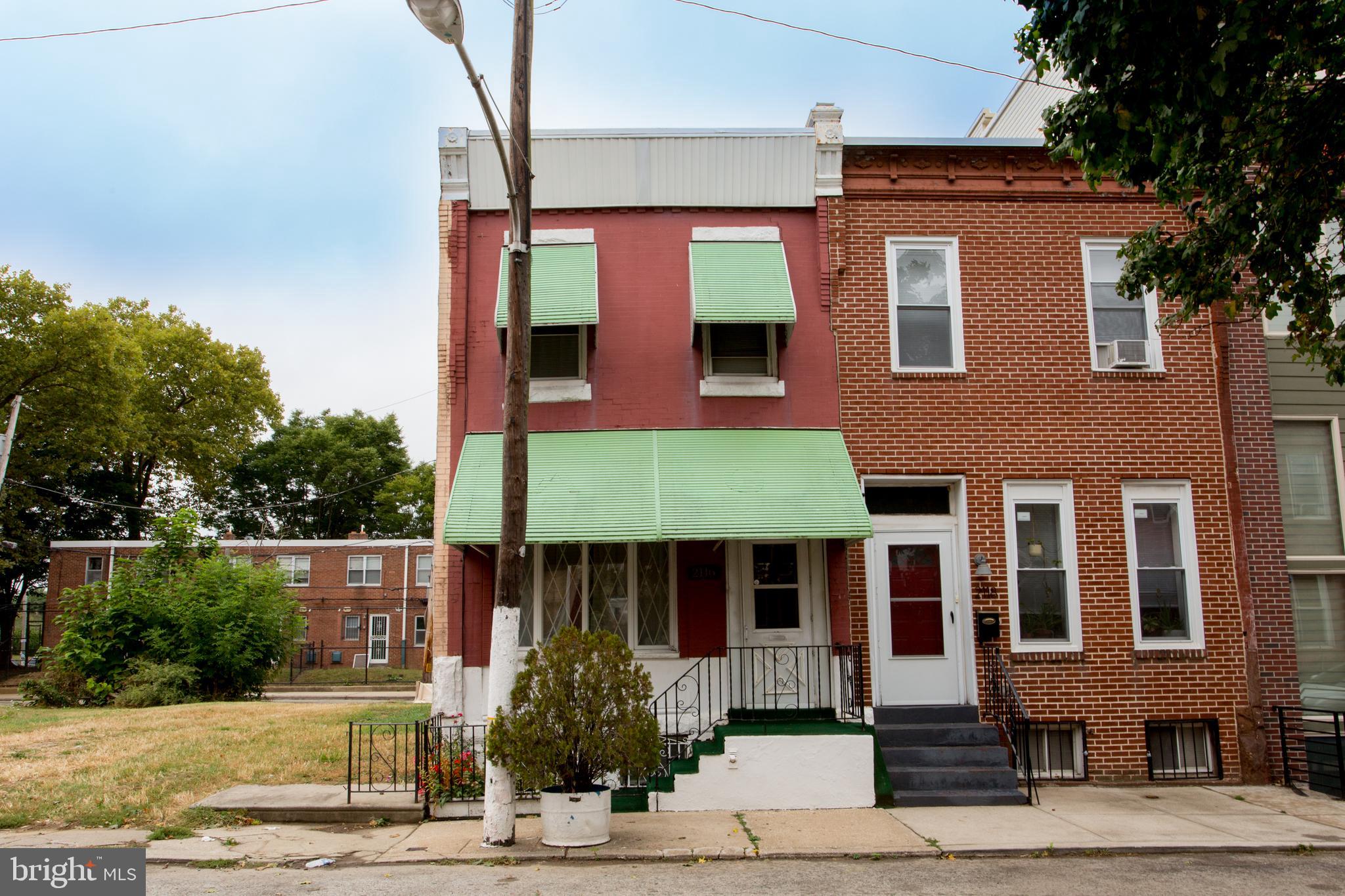 2116 North Natrona Street Philadelphia, PA 19121 - Photo 1 of 53 a front view of a house with a yard