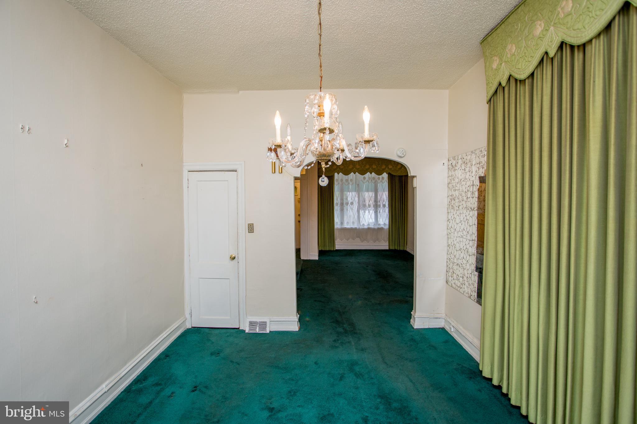 2116 North Natrona Street Philadelphia, PA 19121 - Photo 12 of 53 a view of a hallway with a chandelier