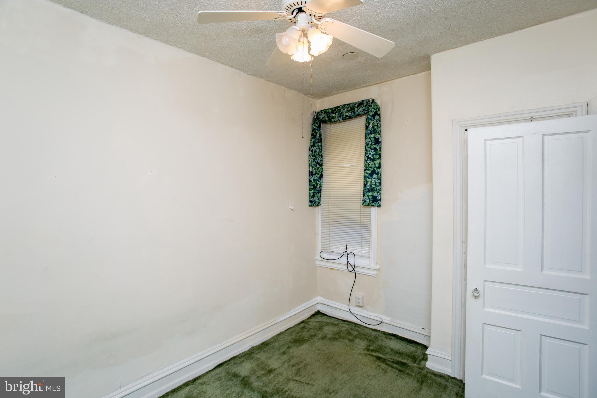 2116 North Natrona Street Philadelphia, PA 19121 - Photo 22 of 53 wooden floor in an empty room