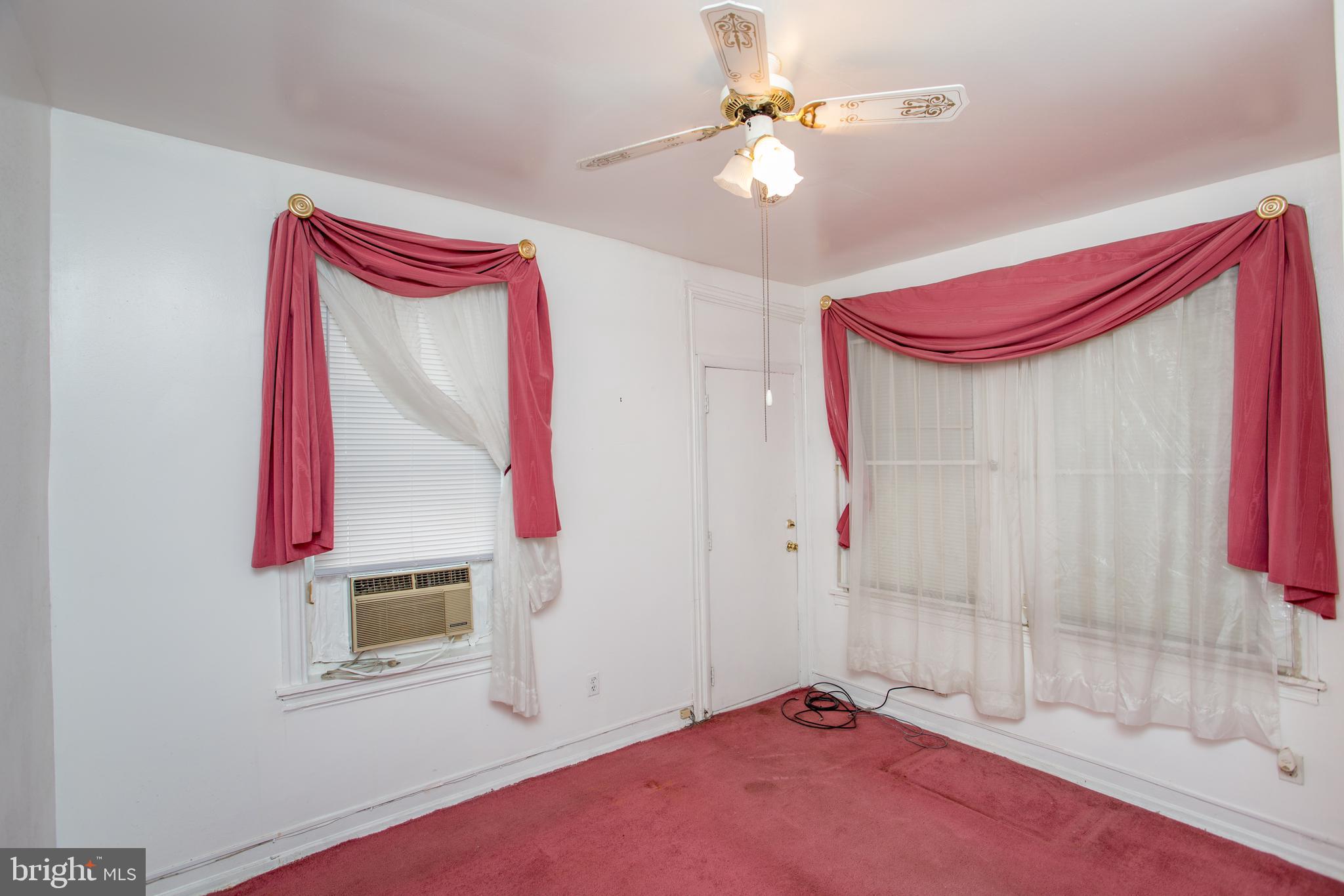 2116 North Natrona Street Philadelphia, PA 19121 - Photo 29 of 53 a bedroom with furniture and a chandelier fan