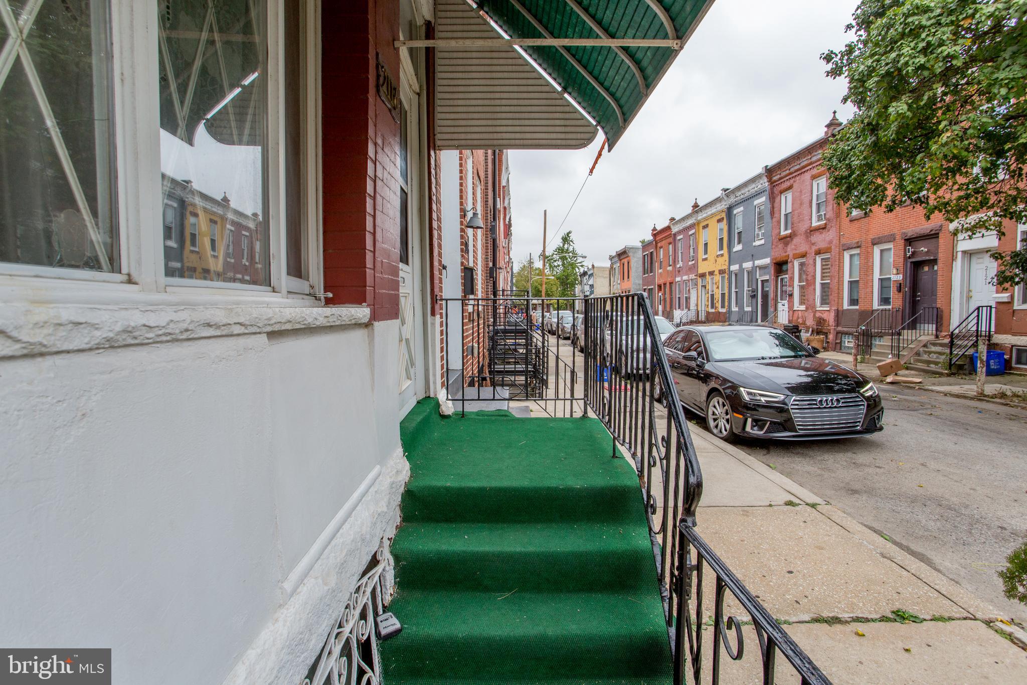 2116 North Natrona Street Philadelphia, PA 19121 - Photo 3 of 53 a view of a street with cars