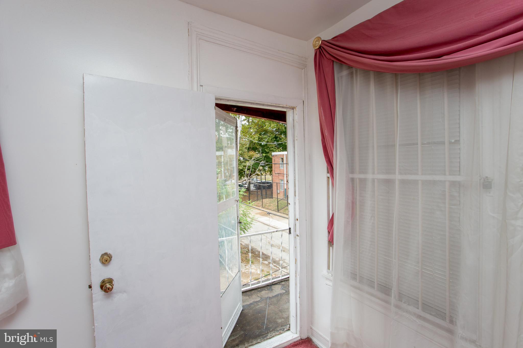 2116 North Natrona Street Philadelphia, PA 19121 - Photo 32 of 53 a yellow room with wooden floor and walls