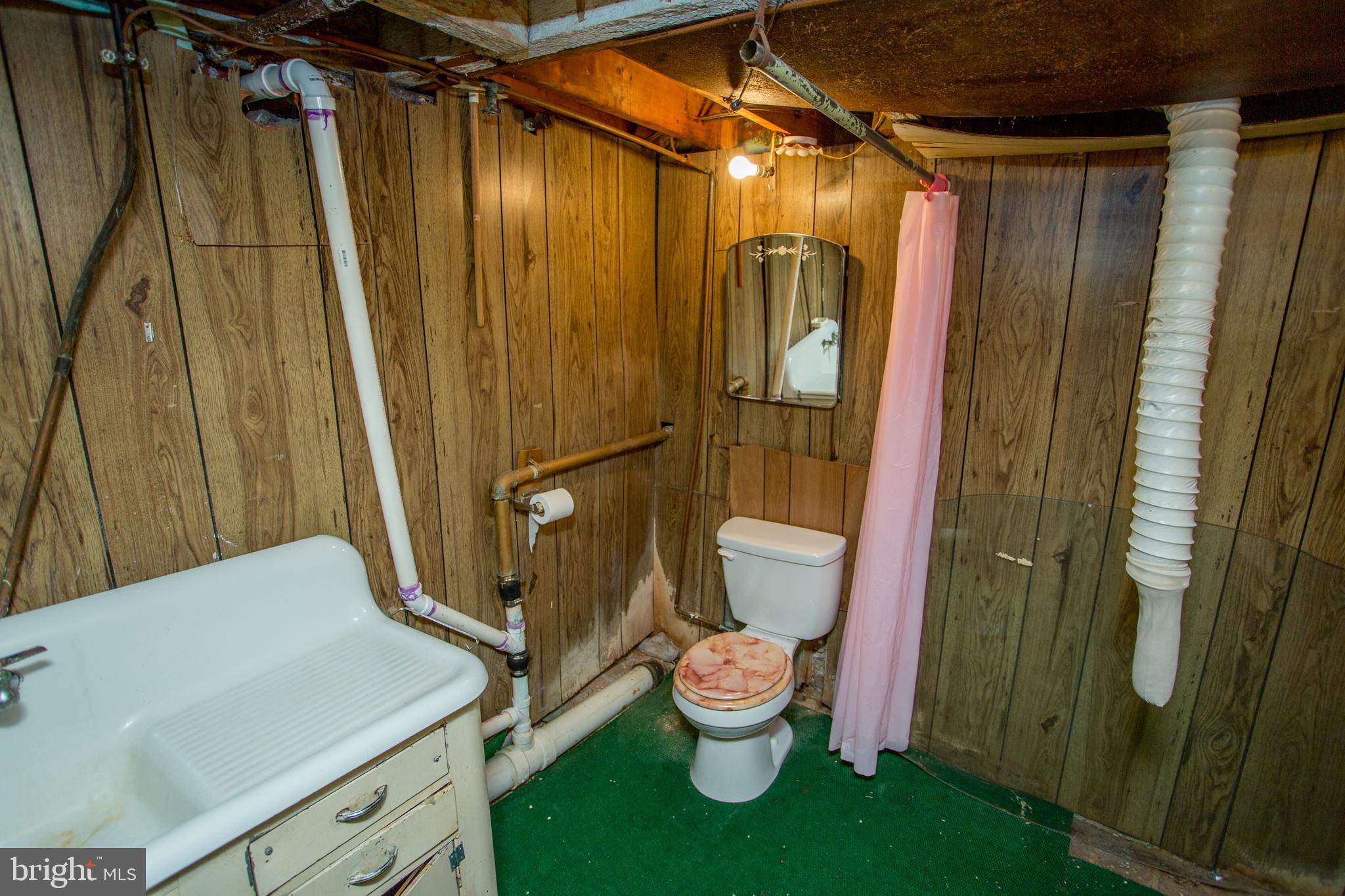 2116 North Natrona Street Philadelphia, PA 19121 - Photo 38 of 53 a bathroom with a sink and toilet