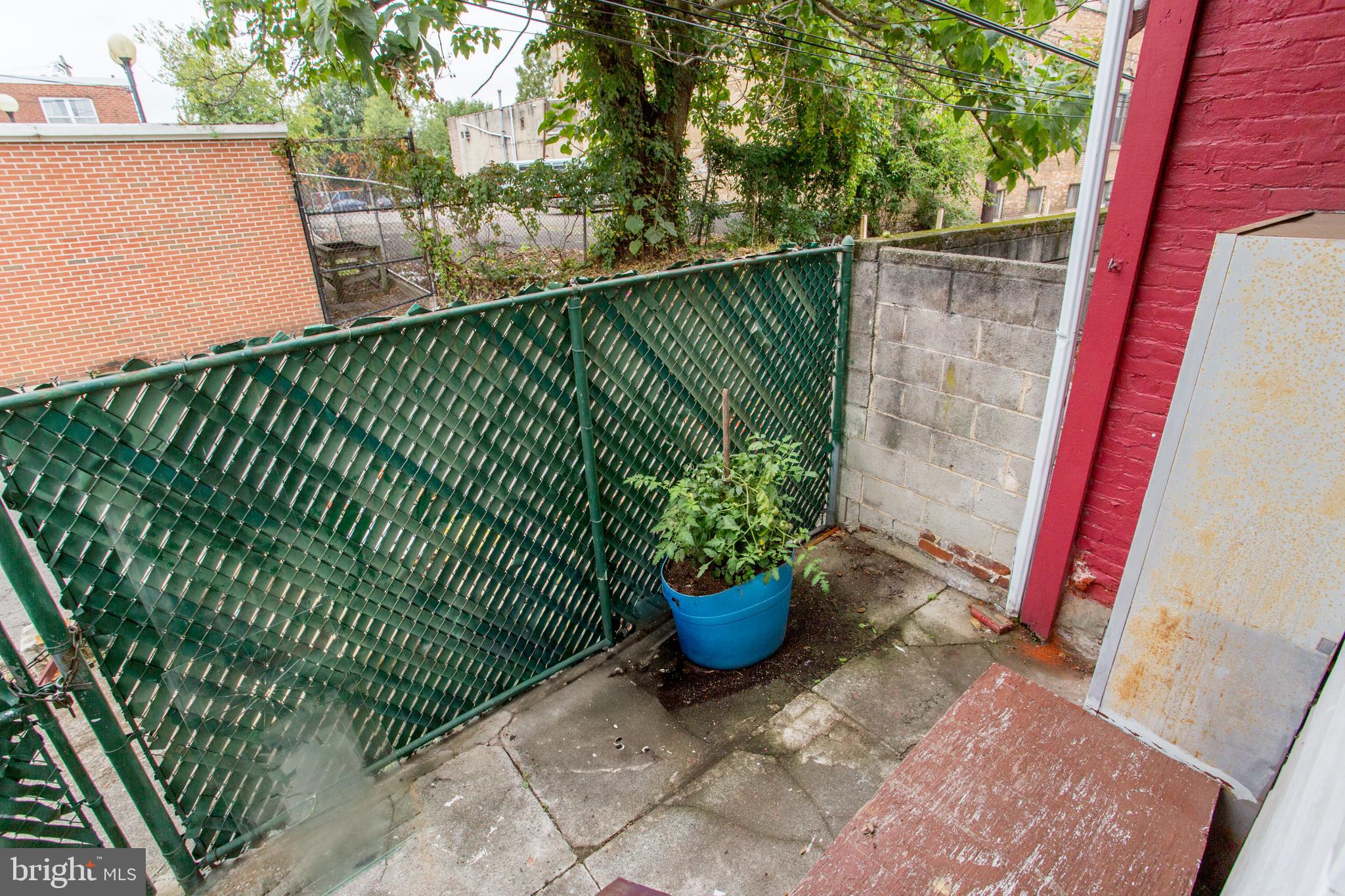 2116 North Natrona Street Philadelphia, PA 19121 - Photo 42 of 53 a view of a backyard with plants