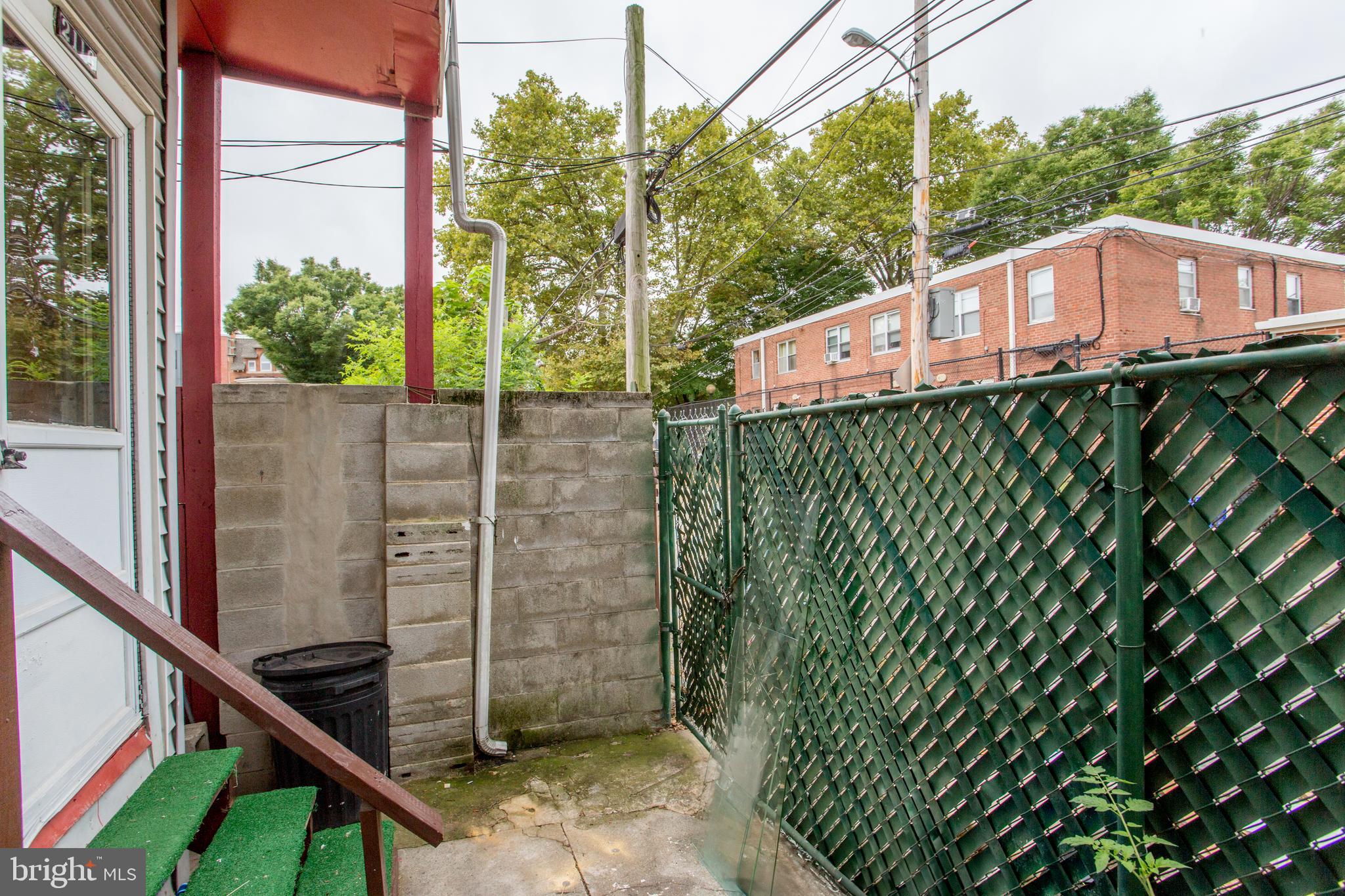 2116 North Natrona Street Philadelphia, PA 19121 - Photo 44 of 53 a view of a house with a fence