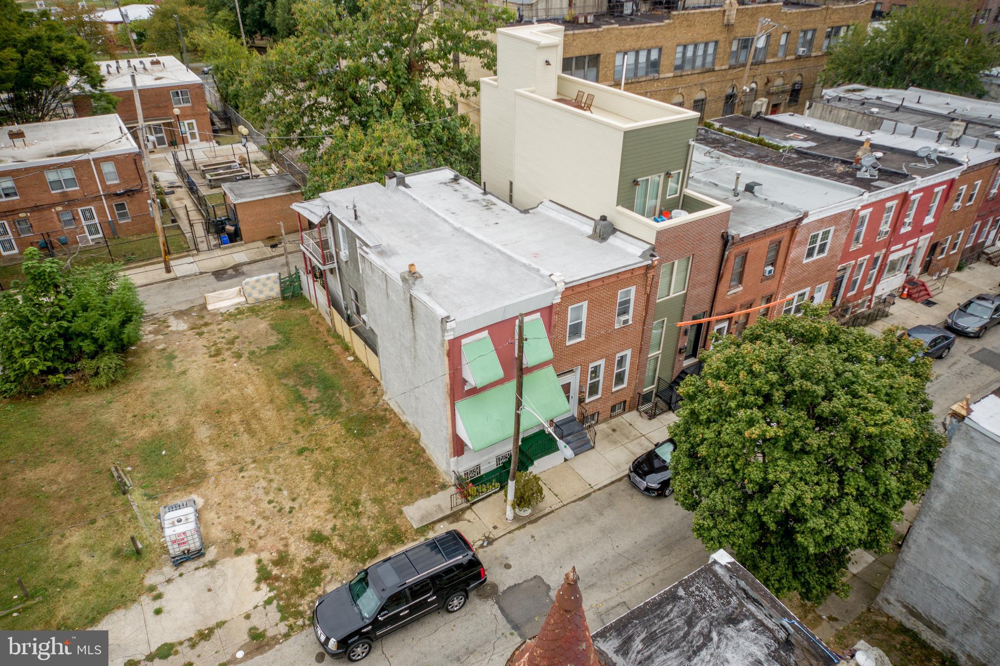 2116 North Natrona Street Philadelphia, PA 19121 - Photo 53 of 53 a aerial view of a house with a yard and balcony