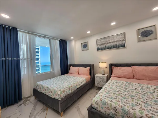 a bedroom with bed and a window