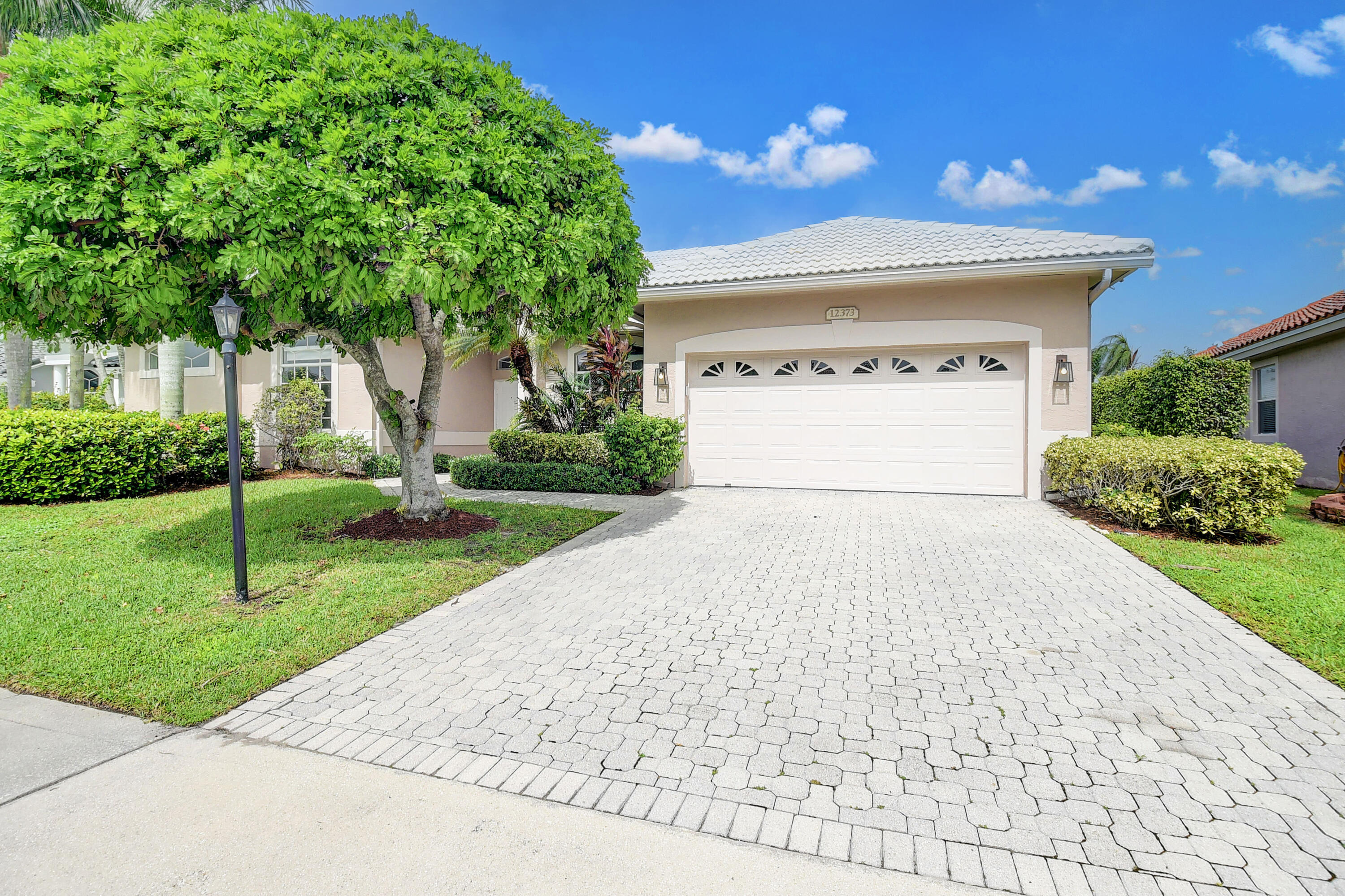 12373 Rockledge Circle Boca Raton, FL 33428 - Photo 3 of 68 a view of backyard of house with green space