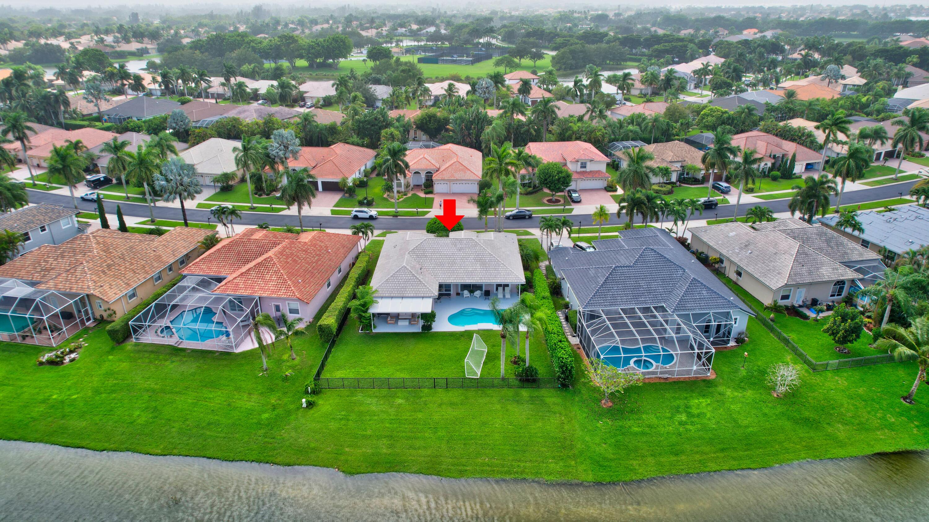 12373 Rockledge Circle Boca Raton, FL 33428 - Photo 48 of 68 an aerial view of residential houses with outdoor space and lake view