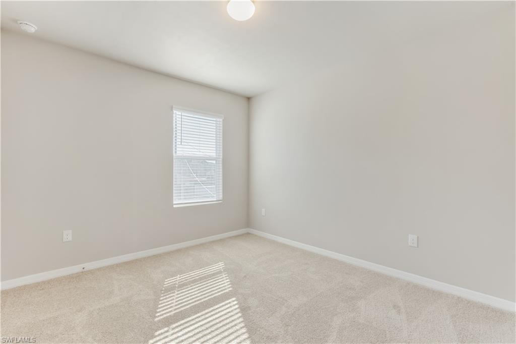 17764 Shade Tree Loop Punta Gorda, FL 33982 - Photo 14 of 48 a view of an empty room with a window