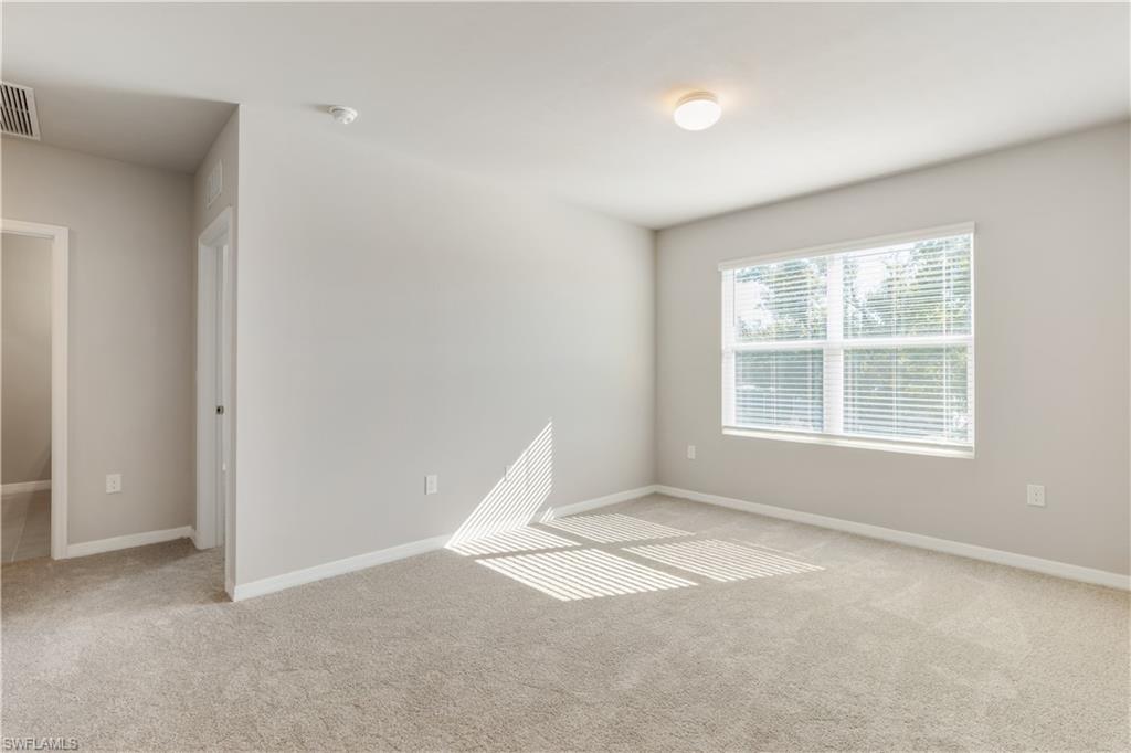 17764 Shade Tree Loop Punta Gorda, FL 33982 - Photo 15 of 48 an empty room with windows