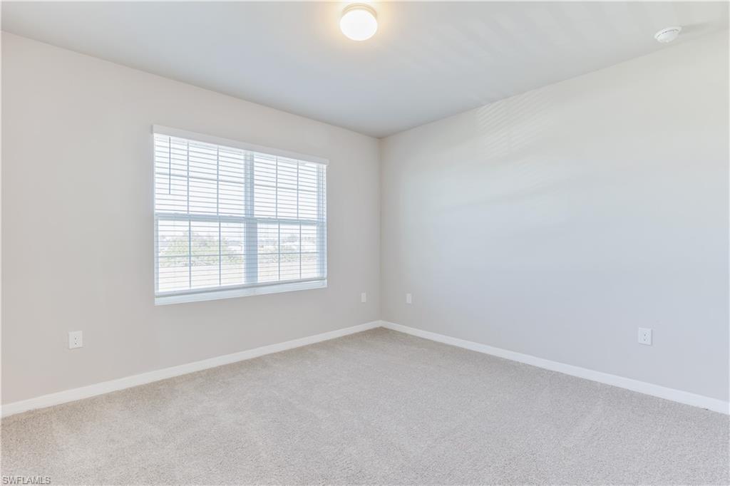 17764 Shade Tree Loop Punta Gorda, FL 33982 - Photo 17 of 48 an empty room with a window
