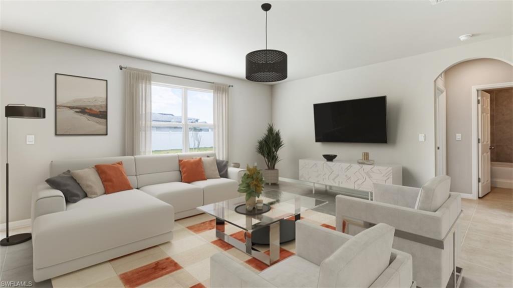 17764 Shade Tree Loop Punta Gorda, FL 33982 - Photo 2 of 12 Living room featuring arched walkways and light tile patterned floors