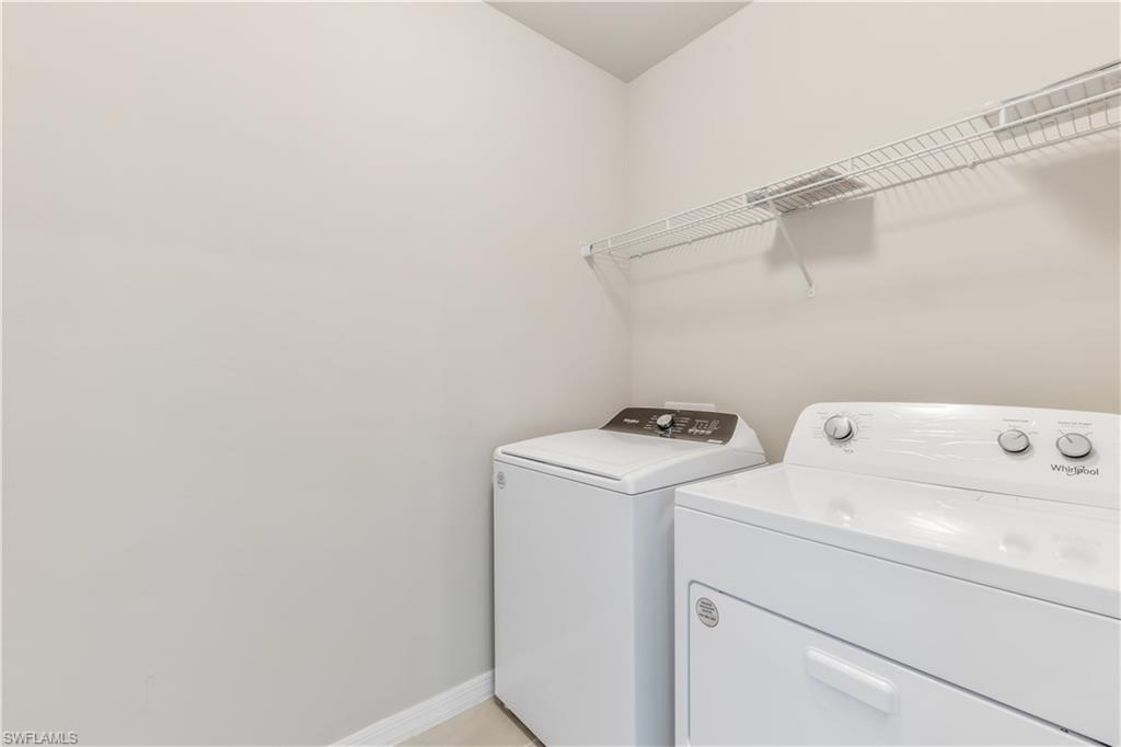17764 Shade Tree Loop Punta Gorda, FL 33982 - Photo 21 of 48 a view of storage and utility room with washer and dryer