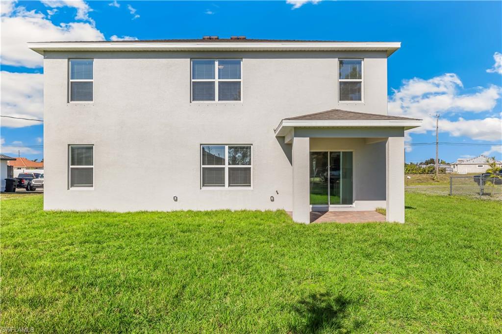 17764 Shade Tree Loop Punta Gorda, FL 33982 - Photo 22 of 48 a front view of a house with garden