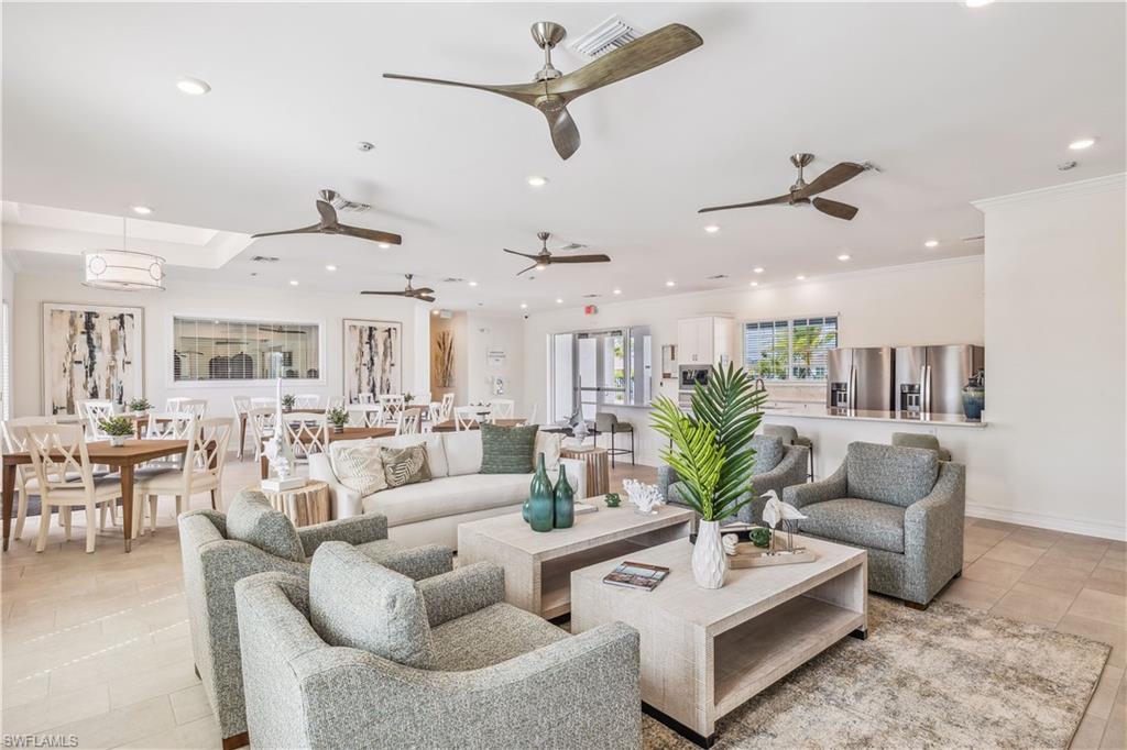 17764 Shade Tree Loop Punta Gorda, FL 33982 - Photo 25 of 48 a living room with furniture kitchen view and a chandelier