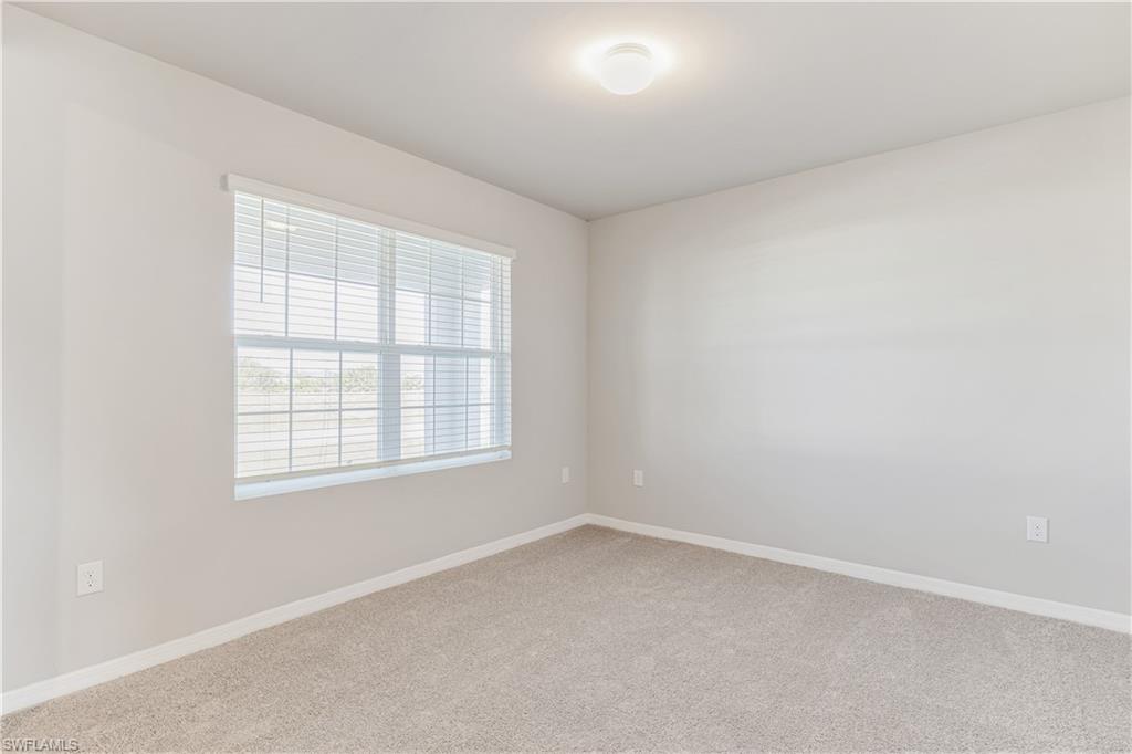 17764 Shade Tree Loop Punta Gorda, FL 33982 - Photo 3 of 48 an empty room with a window