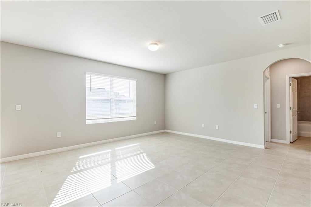 17764 Shade Tree Loop Punta Gorda, FL 33982 - Photo 4 of 48 a view of an empty room with a window