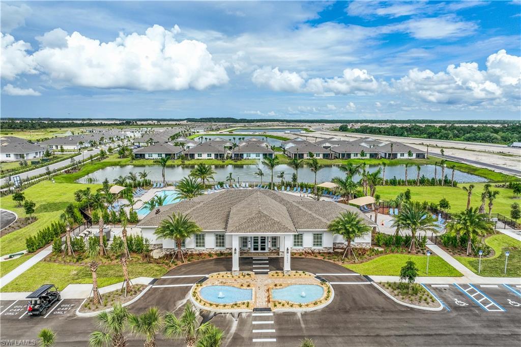 17764 Shade Tree Loop Punta Gorda, FL 33982 - Photo 41 of 48 a view of a swimming pool with a table and chairs