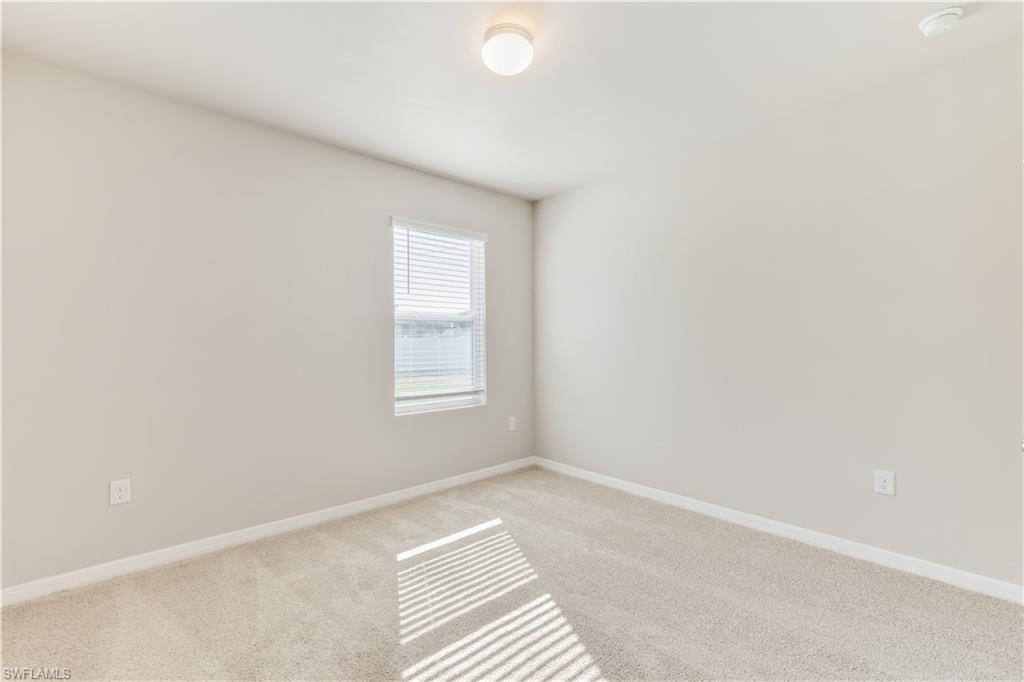 17764 Shade Tree Loop Punta Gorda, FL 33982 - Photo 5 of 48 an empty room with a window