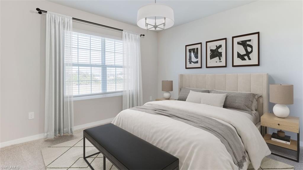 17764 Shade Tree Loop Punta Gorda, FL 33982 - Photo 9 of 12 Bedroom with light carpet