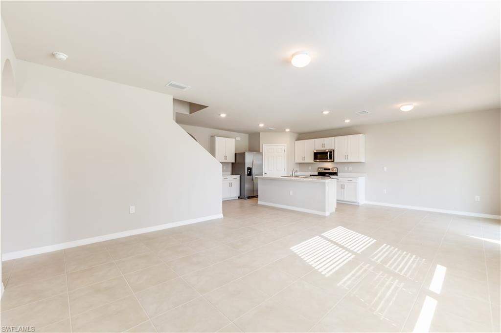 17764 Shade Tree Loop Punta Gorda, FL 33982 - Photo 10 of 48 a view of kitchen with wooden floor