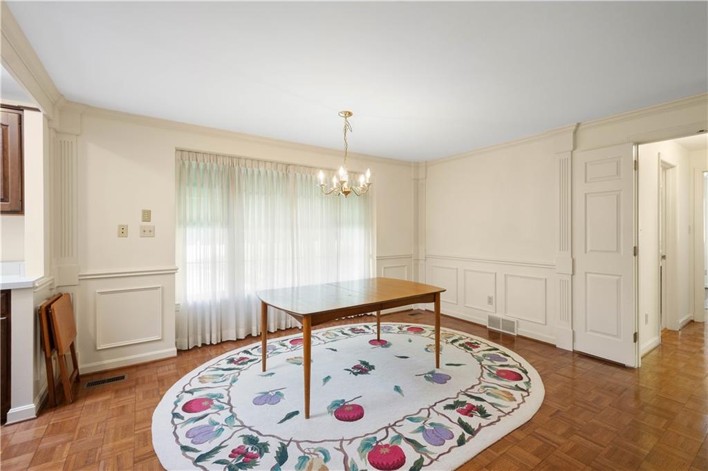 571 West McMurray Road Canonsburg, PA 15317 - Photo 29 of 47 This apartment dining room features parquet floors, chair rail, and crown molding.
