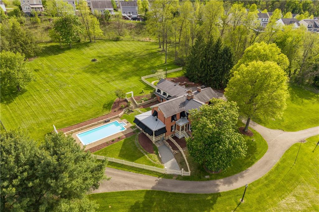 571 West McMurray Road Canonsburg, PA 15317 - Photo 47 of 47 An impressive aerial perspective of the 14-acre estate, showcasing the historic residence, the pristine in-ground pool, and the sprawling level grounds. The property’s commanding presence is further enhanced by its Clean and Green tax status, offering significant real estate tax advantages for this expansive private retreat