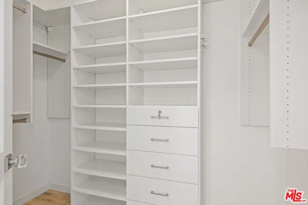 a view of an empty walk in closet
