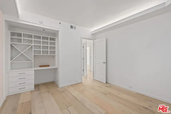 a view of an empty walk in closet