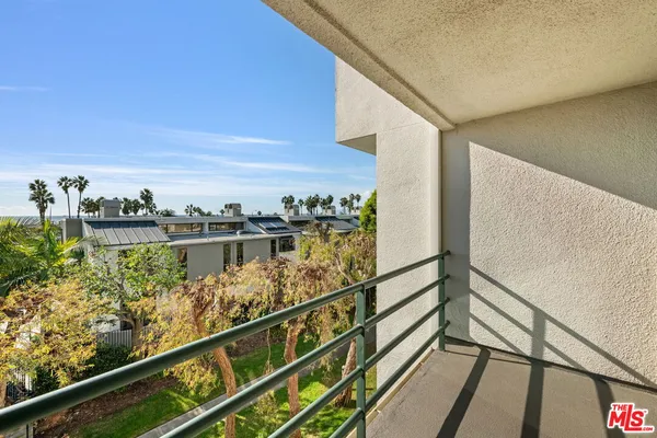 a view of a balcony with furniture