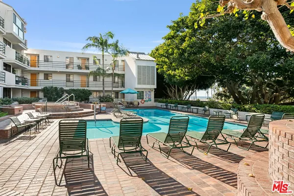 a view of a chairs and table in patio