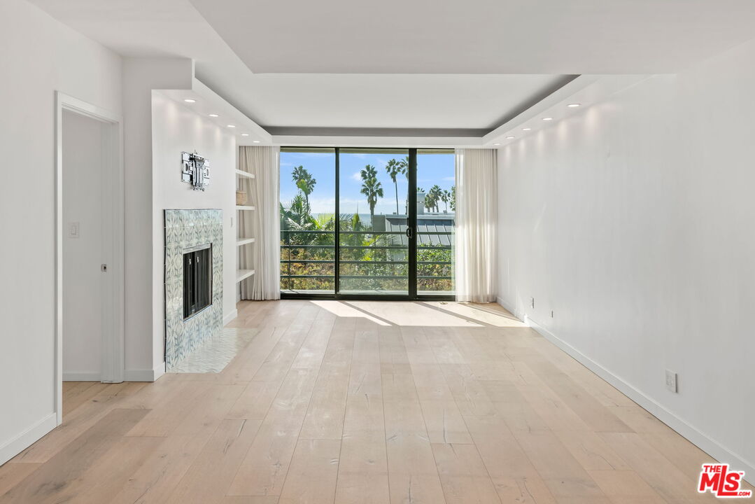 2920 Neilson Way, Unit 303 Santa Monica, CA 90405 - Photo 7 of 34 a view of a big room with windows and chandelier