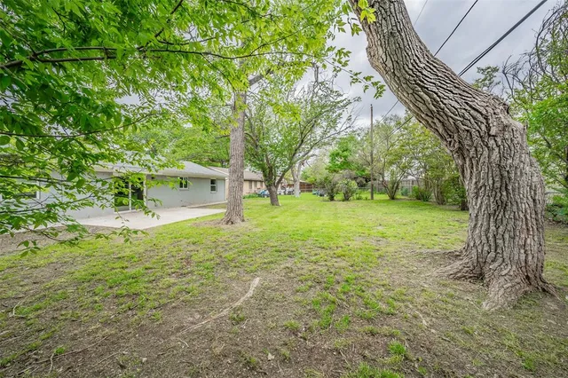 a house with trees in the background