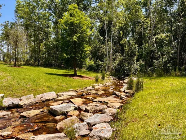 a view of a lake with a big yard