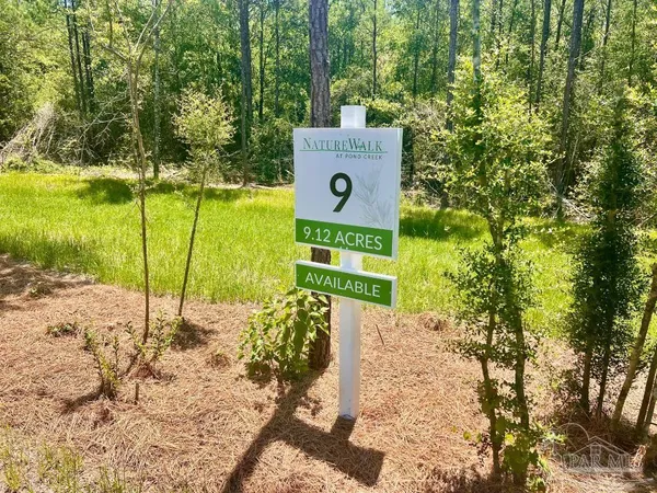 a sign board with yard