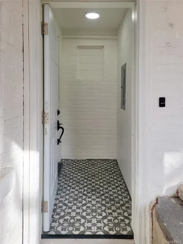 a bathroom with a granite countertop shower