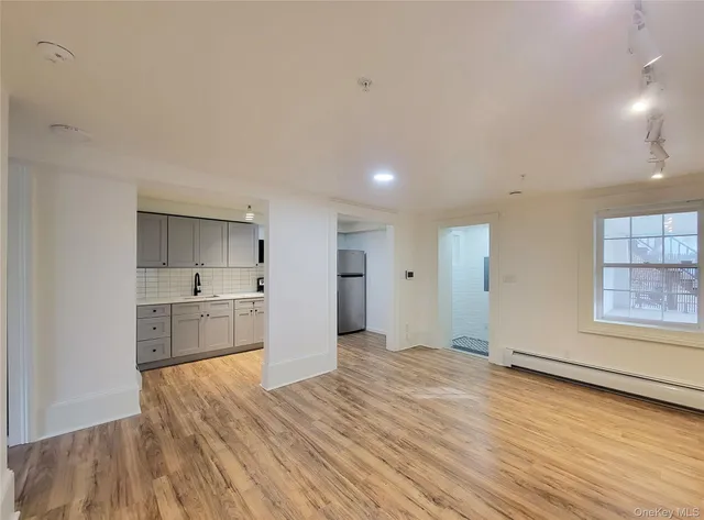 a view of kitchen with wooden floor