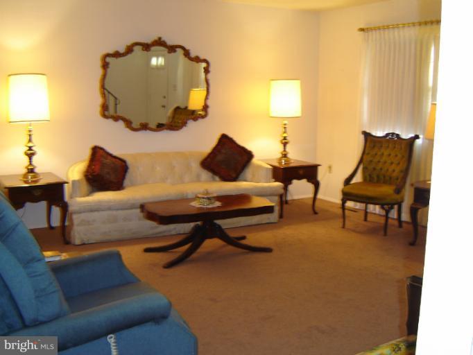 2002 Kennicott Road Windsor Mill, MD 21244 - Photo 12 of 27 a living room with furniture and a lamp