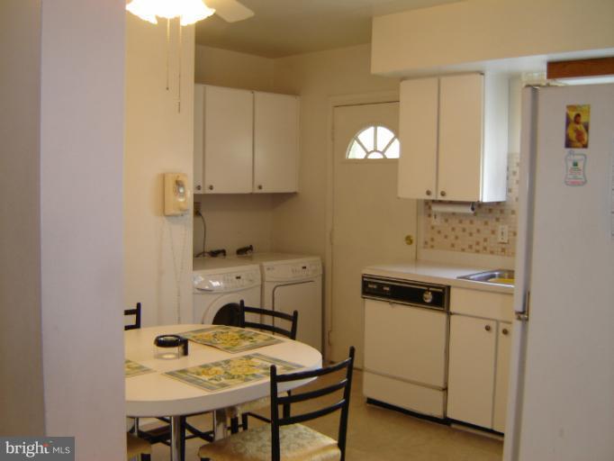 2002 Kennicott Road Windsor Mill, MD 21244 - Photo 15 of 27 a view of a dining room and kitchen with a sink