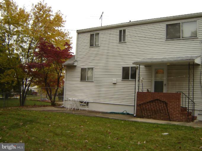 2002 Kennicott Road Windsor Mill, MD 21244 - Photo 17 of 27 a view of a house with a yard