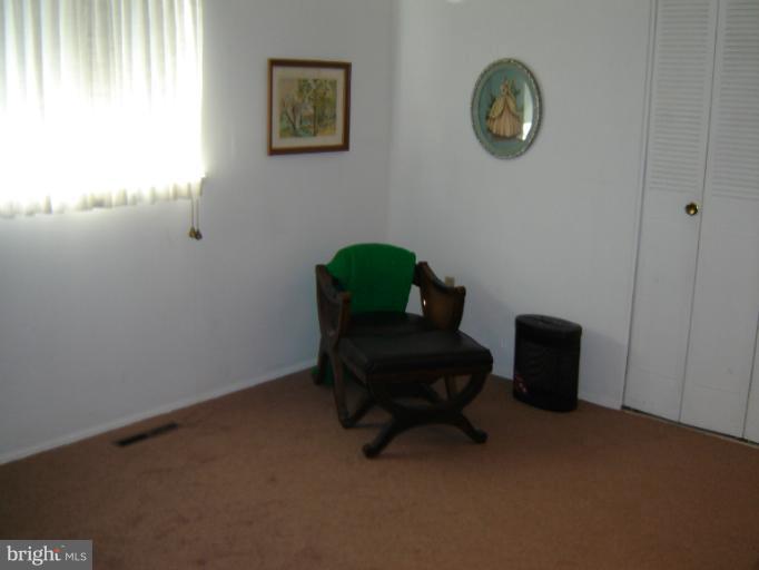 2002 Kennicott Road Windsor Mill, MD 21244 - Photo 23 of 27 a room with a chair and a window