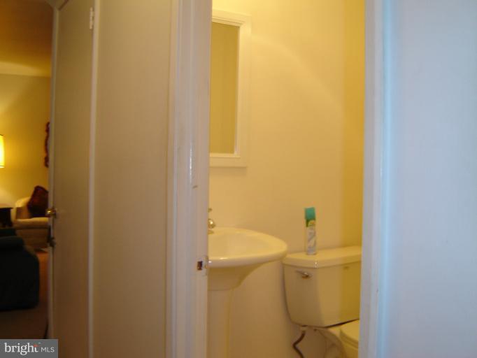2002 Kennicott Road Windsor Mill, MD 21244 - Photo 26 of 27 a bathroom with a sink and toilet