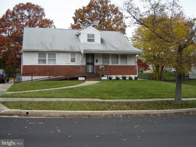 2002 Kennicott Road Windsor Mill, MD 21244 - Photo 27 of 27 a front view of a house with a garden and plants