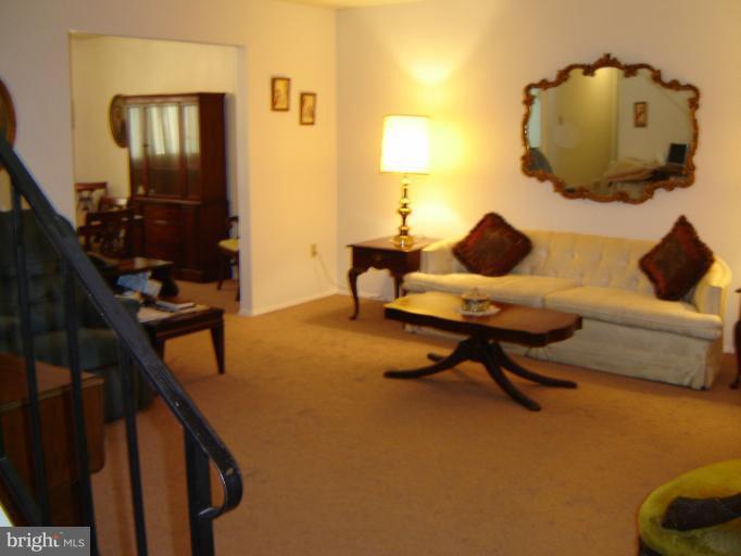 2002 Kennicott Road Windsor Mill, MD 21244 - Photo 5 of 27 a living room with furniture and a mirror