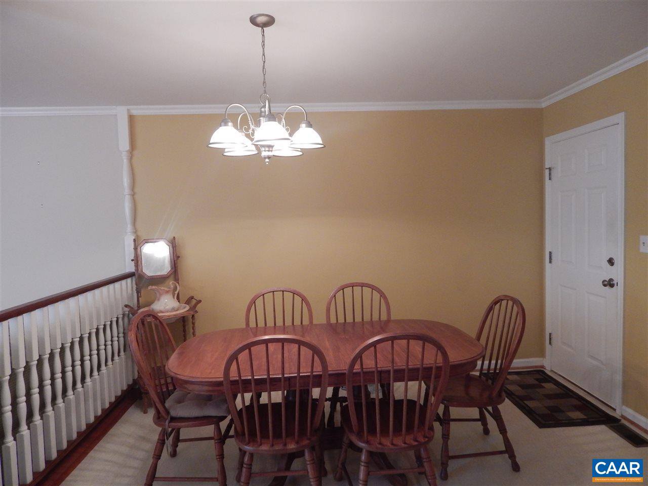 14 East Point Road Palmyra, VA 22963 - Photo 5 of 19 a view of a dining room with furniture wooden floor and chandelier